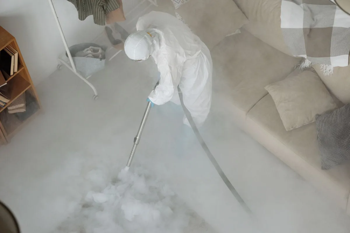 Biohazard cleanup technician in protective equipment, Robla, Sacramento, CA